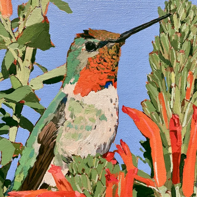 A red-throated hummingbird perches among upright green stems and coral flowers against a pale blue sky.