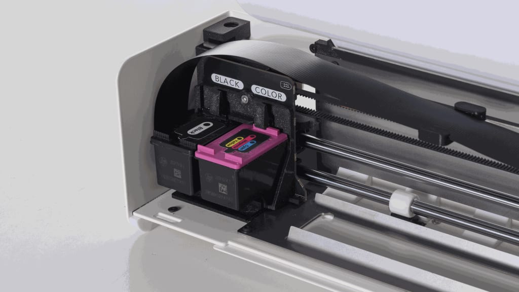 A black and a tri-color HP cartridge seated side by side in the Openprinter carriage