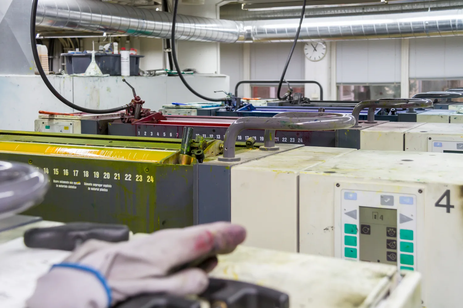 A MAN Roland sheet-fed offset press in a printing workshop
